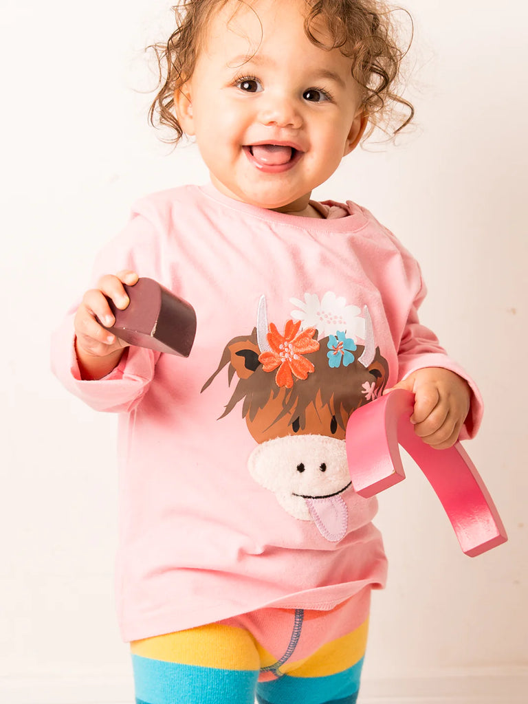 Blade &amp; Rose Bonnie the Highland Cow Top - bold, bright and fun! This gorgeous pale pink top features a sweet Bonnie the Highland Cow design. Sold by Say It Baby Gifts