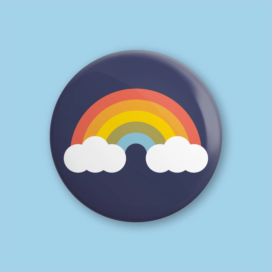 Hey There Munchquin Retro Rainbow Button Badge - a quirky and fun pin badge featuring a retro coloured rainbow on a navy background.