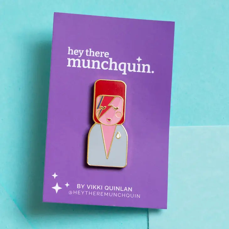 Munchquin David Bowie As Ziggy Stardust Hard Enamel Pin - a quirky and fun enamel pin badge featuring the legendary David Bowie.
