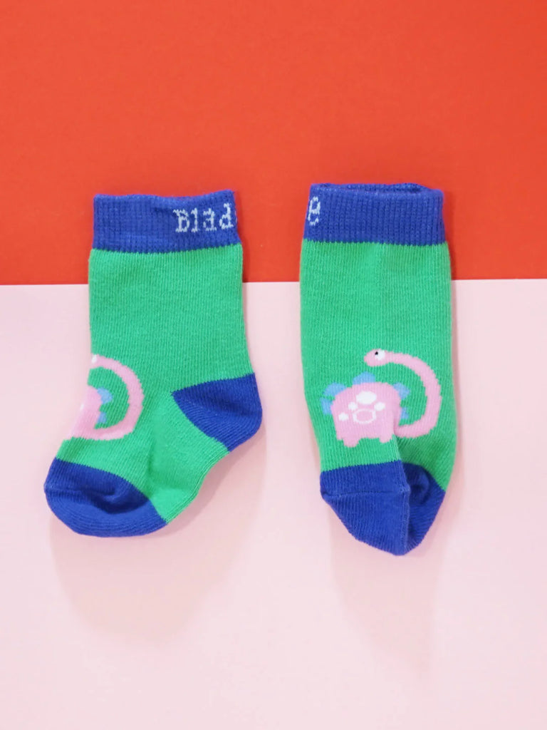 Blade & Rose Bright Dino Socks - bold, bright and fun! These gorgeous socks in green and purple have a gorgeous dino design. Sold by Say It Baby Gifts