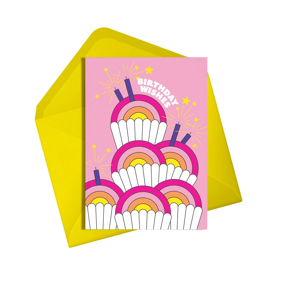 This colourful card from Alphabots features an pink neon cupcake design and the words "Birthday Wishes"