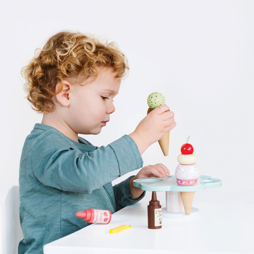 Le Toy Van Carlos Gelato Ice Cream Set - let kids imagination go to town with this fabulous ice-cream stand as they create special ice creams with a variety of toppings for their very own customers!   Sold by Say It Baby Gifts. Raspberry and Chocolate Sauce. Great to add to a play cafe or shop.