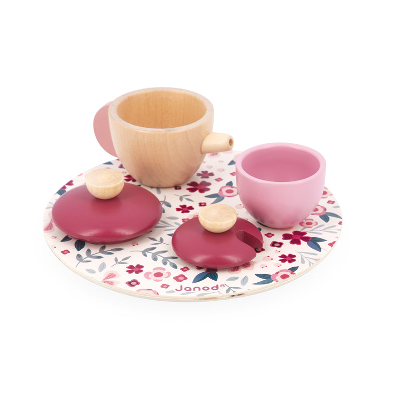 Janod Twist Tea Set. The set includes a wooden teapot, sugar bowl, two cups, two saucers and three spoons as well as two felt teabags, two lemon slices and two biscuits for extra fun!