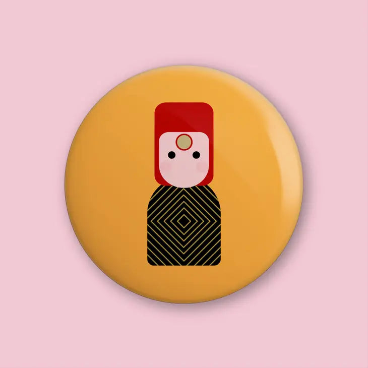 Munchquin David Bowie As Ziggy Stardust Button Badge - a quirky and fun pin badge featuring the legendary David Bowie.