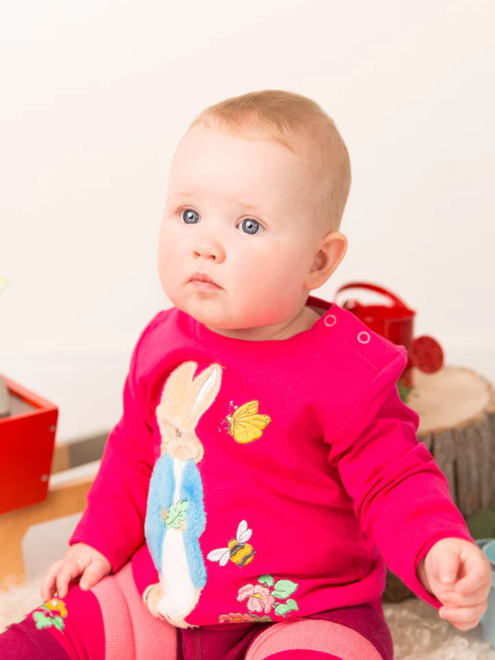 Blade & Rose Peter Rabbit Autumn Leaf Top - bold, bright and fun! This gorgeous top in a deep pink features a soft fleece applique Peter Rabbit. Sold by Say It Baby Gifts