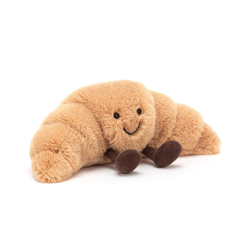 Jellycat Amuseable Croissant - Small A6C. Sold by Say It Baby Gifts. Front view with cordy boots