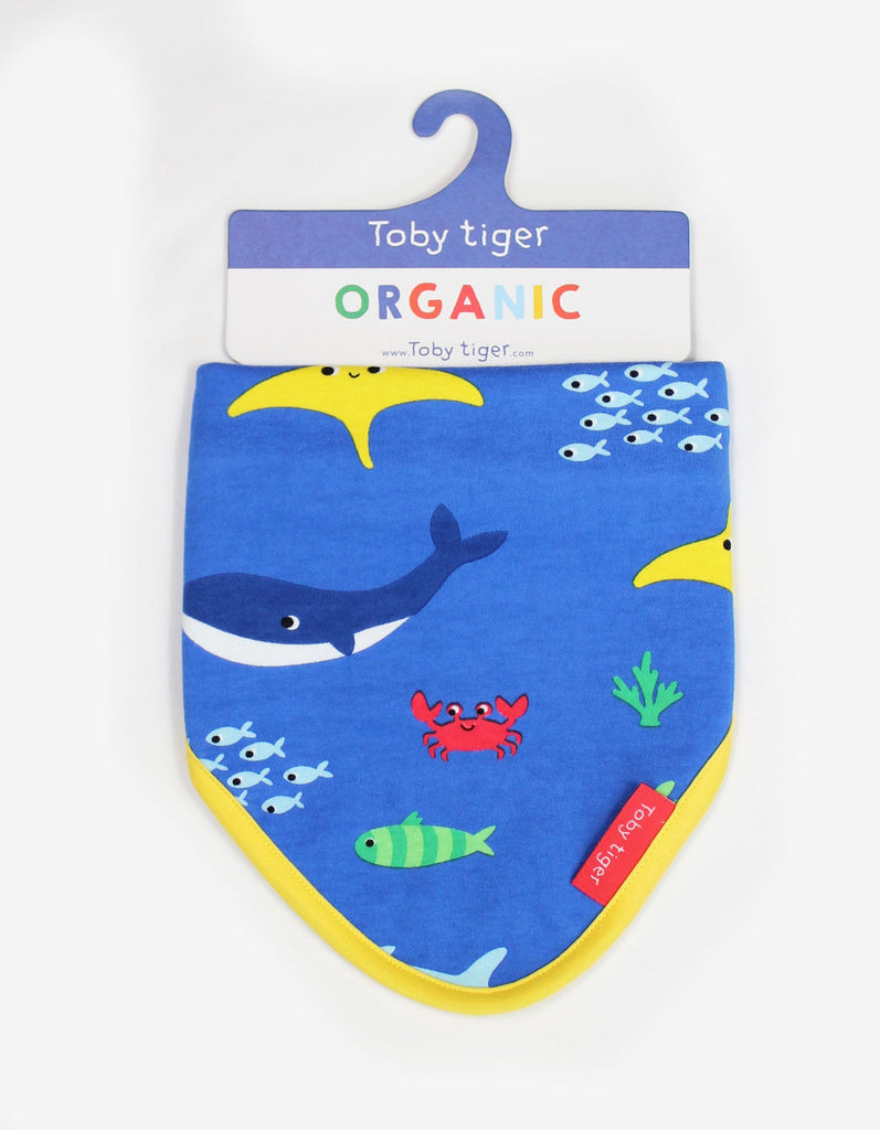 Toby Tiger Sealife Dribble Bib- A gorgeous bib in blue featuring cute underwater creatures with a bold yellow trim. Sold by Say It Baby Gifts