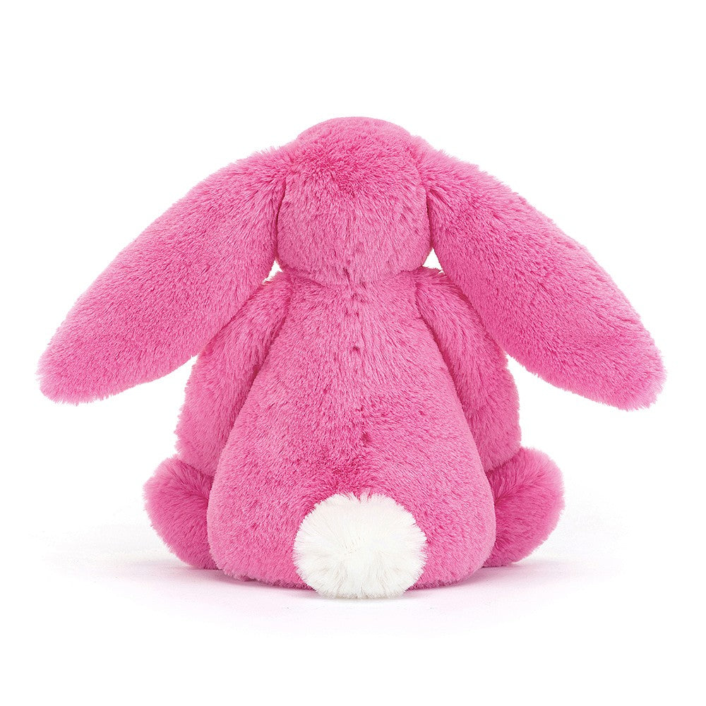 This super soft Jellycat Hot Pink Bunny has dragonfruit pink fur and a pastel-pink nose.  Sold by Say it Baby Gifts. Small. BASS6BHP- white bob tail