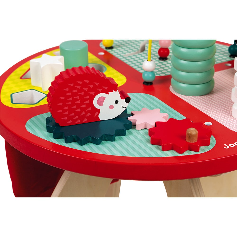 Janod Baby Forest Activity Table. Little ones can develop their motor skills with the chunky stackable wooden pieces that form the three animals on the stems that each have their own hidden challenges, whilst also learning colours and shapes.