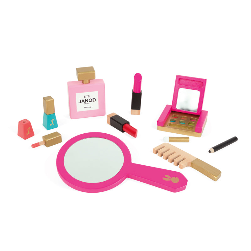 This pretty pink vanity case with zipper and fabric handle, houses 9 wooden accessories including a large mirror, a makeup palette with brush and built-in mirror, 2 lipsticks, 2 nail varnishes, 1 eyeliner pencil, 1 perfume bottle and 1 brush.