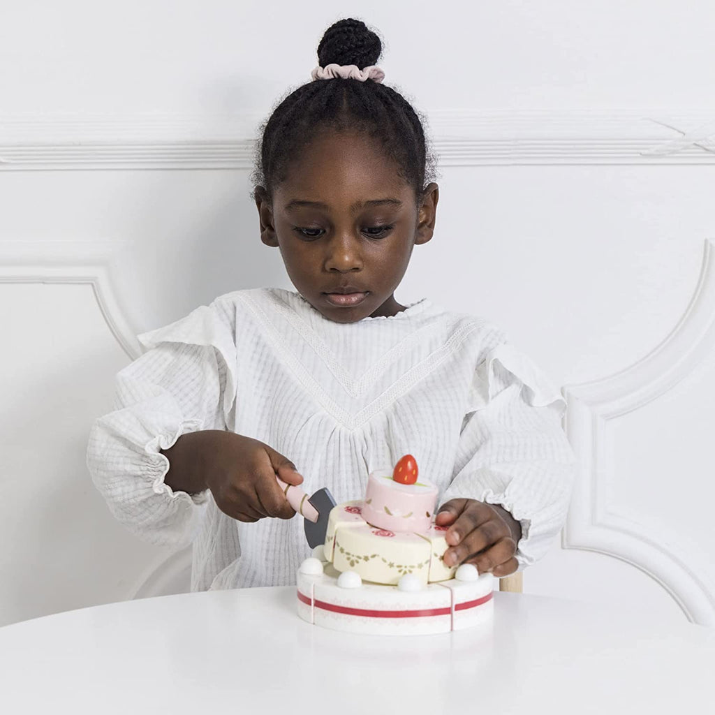 Le Toy Van Strawberry Wedding Cake - Le Toy Van toys are all ethically made, using natural materials, including replenishable quality smooth rubber-wood and an array of techniques from hand screen printing to water staining. Their detailed hand-finished toys are unique and loved by little hands!