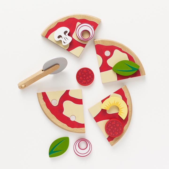 Le Toy Van Wooden Toy Pizza - The set includes wooden pizza in 4 sections, removable pizza toppings, pizza cutter and it's even presented in a pizza box! 