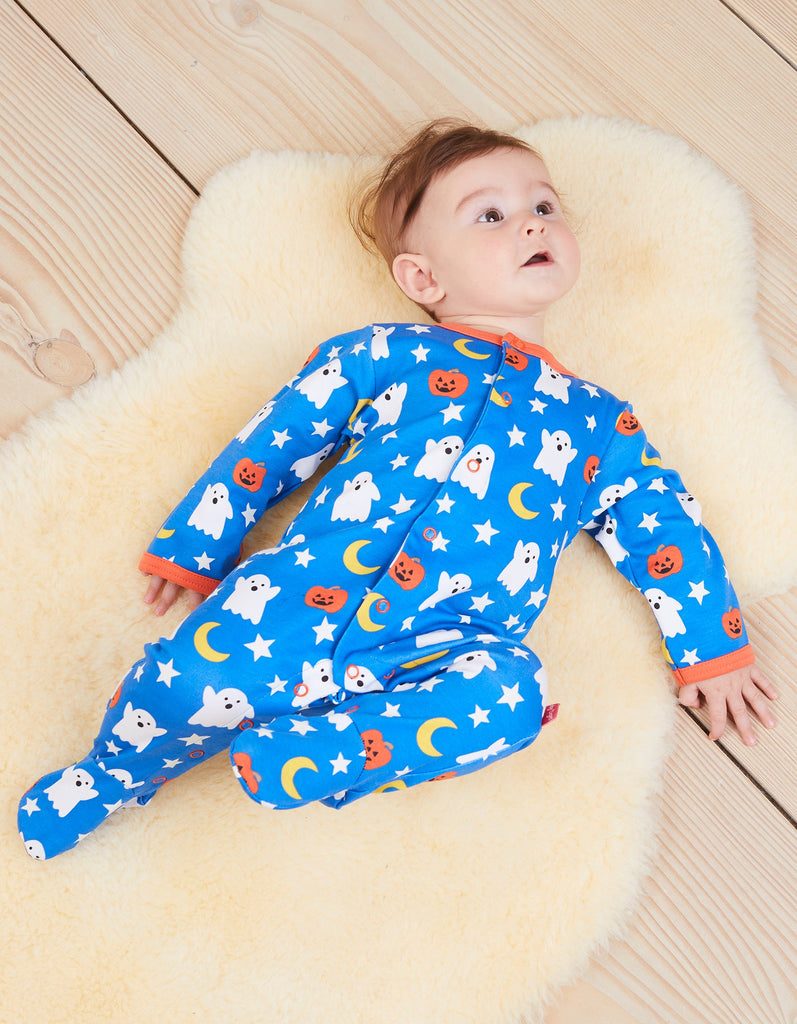 This fabulous Ghost Print sleepsuit in blue by Toby Tiger features friendly white ghosts, sweet jack o'lanterns and star print with a bold orange trim. Sold by Say it Baby Gifts