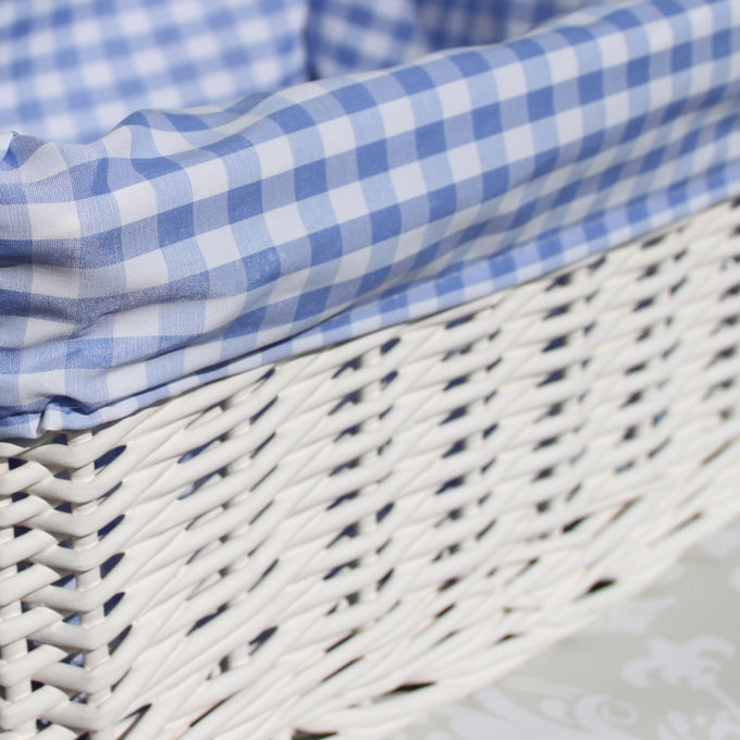 White Wicker Basket with Blue Gingham Lining - Medium. Dimensions : 35x24x12cm high. Sold by Say It Baby Gifts