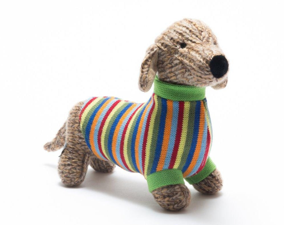 A gorgeous sausage dog all wrapped up in a dapper knitted rainbow striped jumper by Best Years. Sold by Say it Baby Gifts.