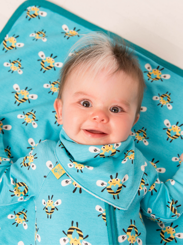 Blade & Rose Buzzy Bee Bib - bold, bright and fun! This gorgeous bandana bib is turquoise with a sweet black and yellow bee design with a love heart centre. One Size. Say It Baby Gifts
