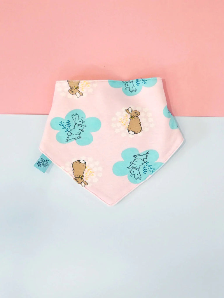 Blade & Rose Peter Rabbit Pretty Garden Bib - bold, bright and fun! This gorgeous bandana bib in pale pink  features an adorable Peter Rabbit design. Sold by Say It Baby Gifts