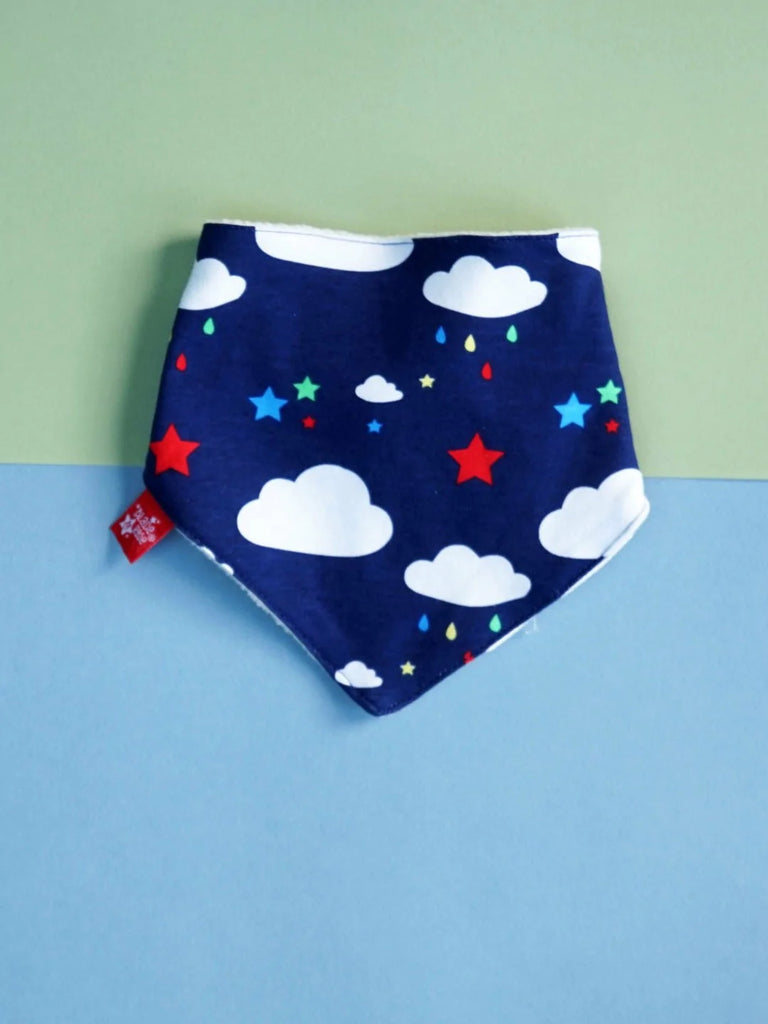 Blade & Rose Weather Bib - bold, bright and fun! This gorgeous bandana bib is navy in colour with the cutest weather design of fluffy white clouds and multi-coloured stars and raindrops. 