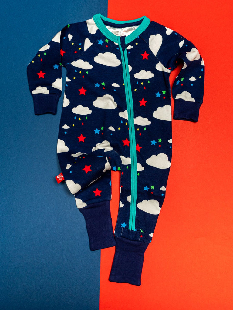 Blade & Rose Weather Zip Up Romper - bold, bright and fun! This fab romper is navy blue with contrasting teal zip and the cutest weather design of fluffy white clouds and multi-coloured stars and raindrops.