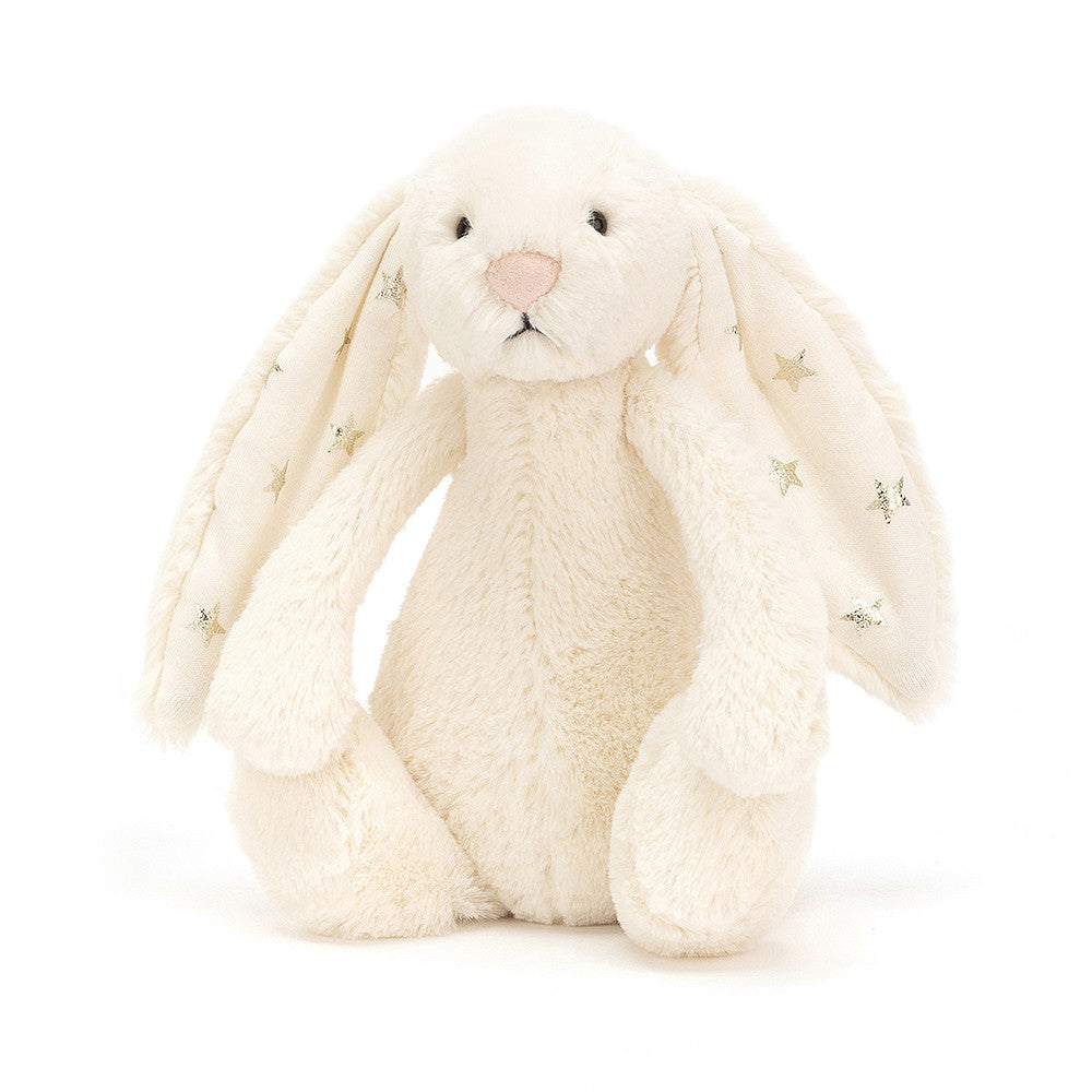 Small Bashful Twinkle Bunny shimmers and shines with the softest creamy fur and glimmering silver stars in her ears. Sold by Say It Baby Gifts
