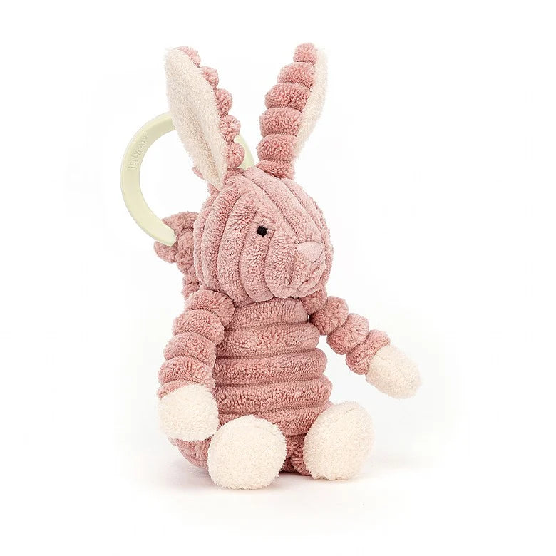 Jellycat Cordy Roy Baby Bunny Jitter Toy- a soft and squashy dusky pink coloured bunny rabbit with cream paws and chunky cordy body.  Sold by Say It Baby Gifts