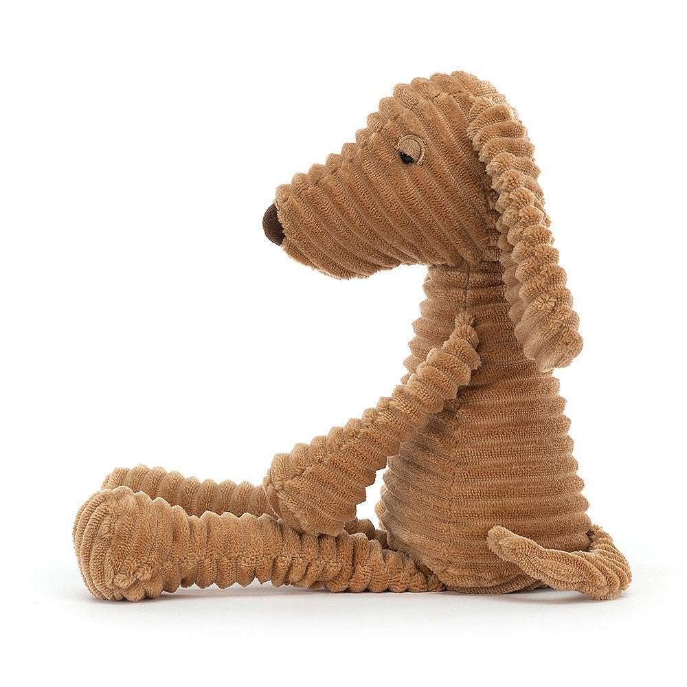 Jellycat Ribble Dog - side view.  With soft, chunky fur, fudge nose, cordy paws and waggly ears, he is a delightful pal ready to loaf about and snuggle.