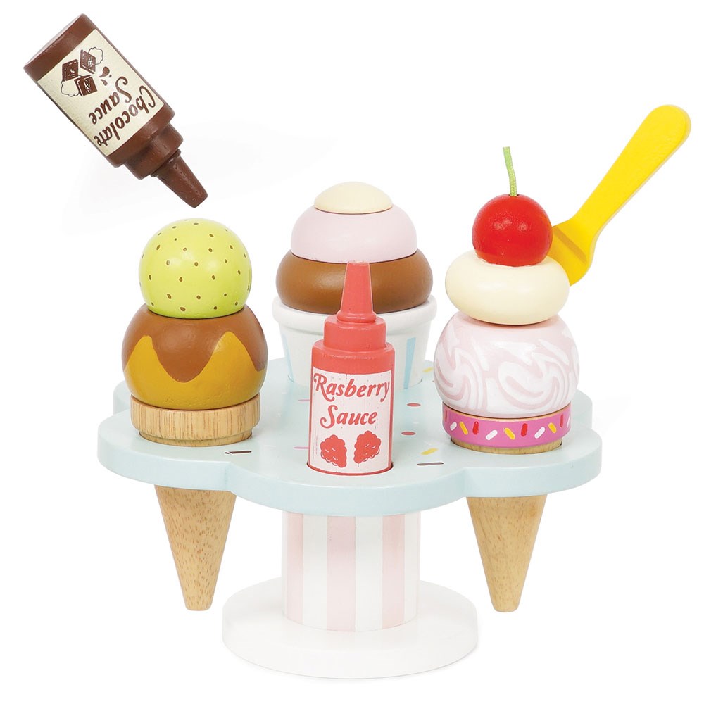 Le Toy Van Carlos Gelato Ice Cream Set - let kids imagination go to town with this fabulous ice-cream stand as they create special ice creams with a variety of toppings for their very own customers!   Sold by Say It Baby Gifts. Raspberry and Chocolate Sauce.