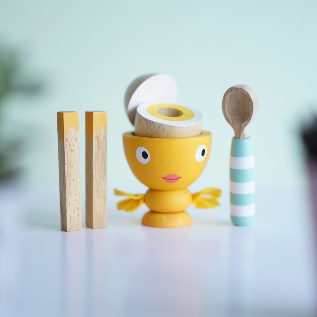 Made of solid rubberwood and finished in water-based colours, the egg cup has hand stitched felt wings, wooden egg with magnetic top, two hand painted solid rubberwood 'soldiers' and a painted wooden spoon. A great gift for age 2 and over.