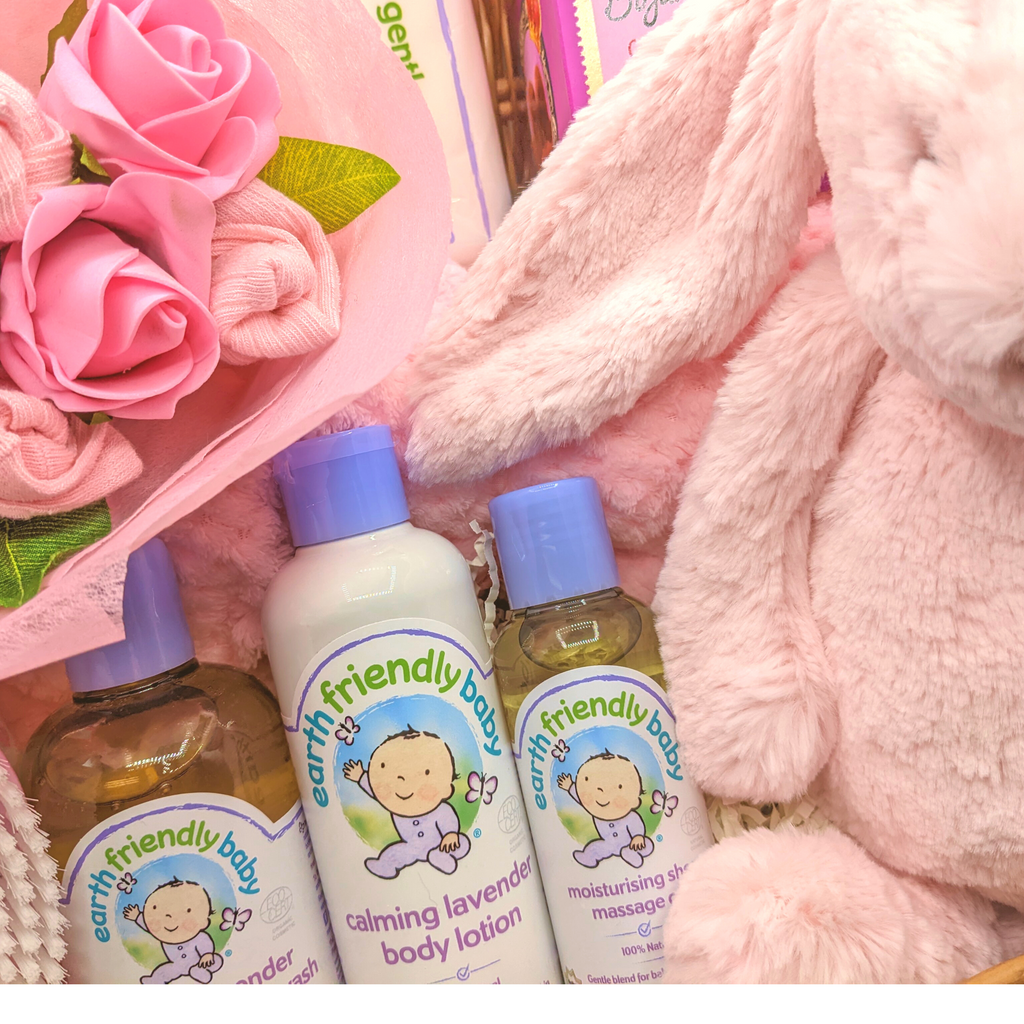 Say It Baby New Baby Girl Hamper filled with lovely new baby gifts including earth friendly baby products and a sweet mini baby girl bouquet