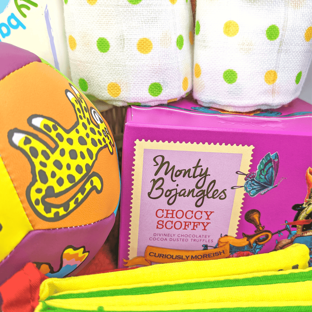 Hello Sweetie Bright Baby Hamper. Bright and colourful new baby hamper full of gifts by Say It Baby. includes monty bojangles chocolates