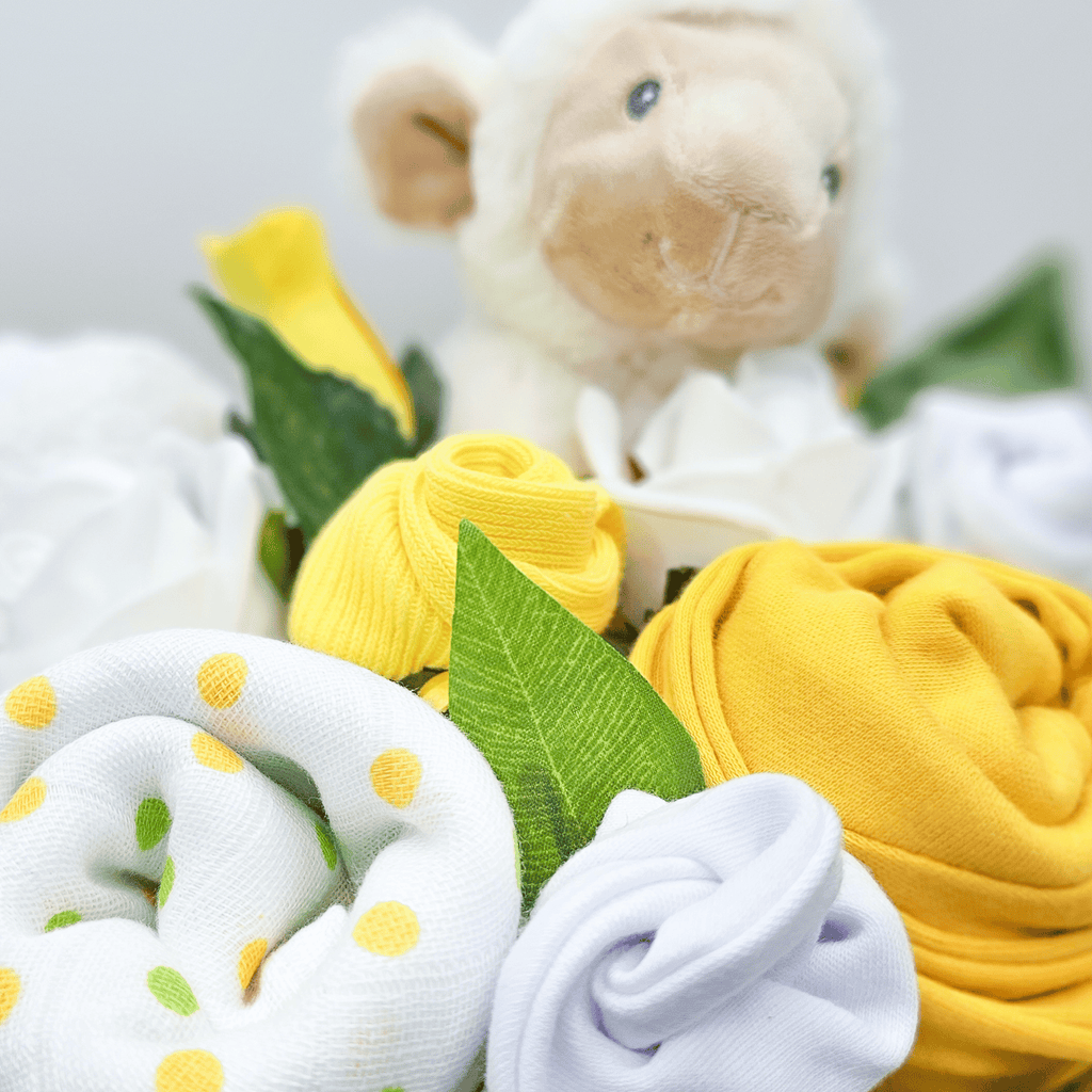 Say It Baby - Spring Baby Clothes Flower Box - a perfect gift for a spring time arrival. Sold by Say It Baby Gifts. Closeup of baby bouquet