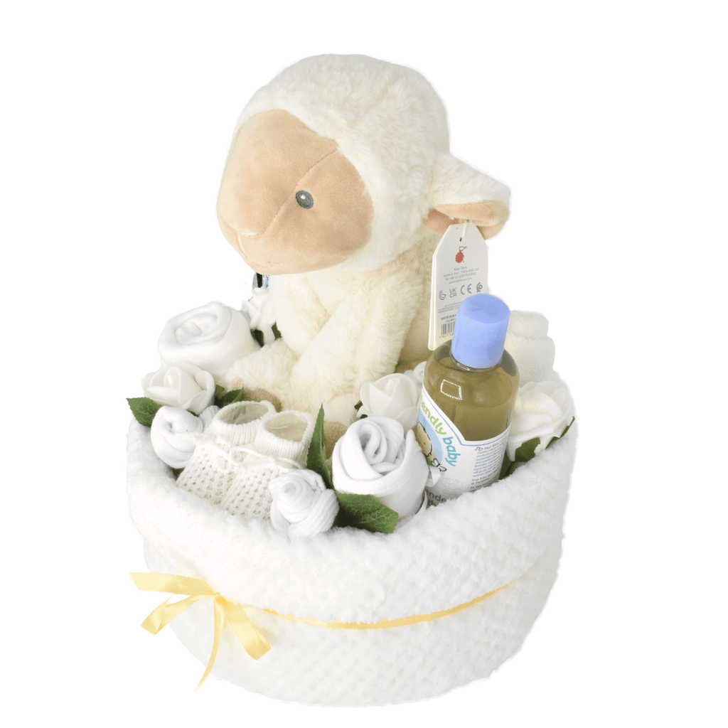 Unisex Baby Nappy Cake Bouquet - White. This nappy cake bouquet is sure to impress! Created using nappies and a soft baby blanket (and filled with lots of goodies), the gorgeous cake is then hand-wrapped in eco-friendly wrap with lots of pretty ribbons and bow. A lovely gift for boy or girl.