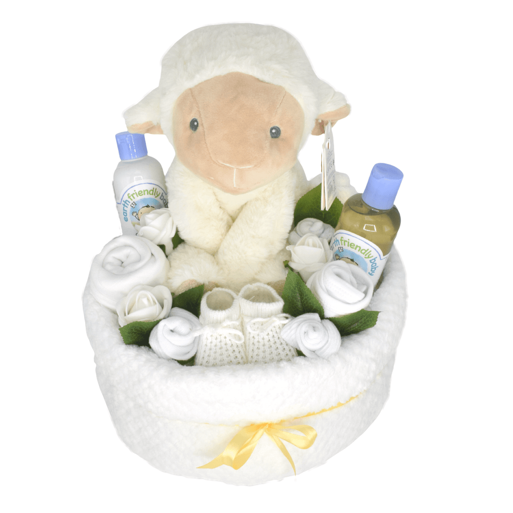 Unisex Baby Nappy Cake Bouquet - White. This special nappy cake in white and creams is deep filled with lots of lovely baby items including baby booties, socks, muslin square, bib, washcloth, baby toiletries and a lovely soft toy lamb.